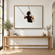 Load image into Gallery viewer, Child on a swing painting displayed in a framed neutral living room

